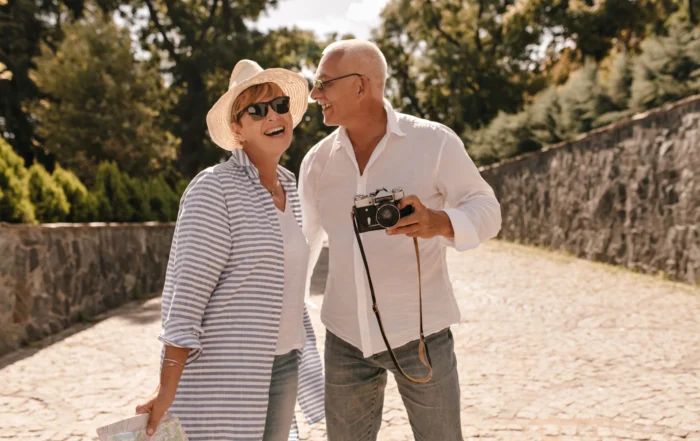 Smiling retired couple enjoying travel together after financial planning with advisors in Alpharetta GA