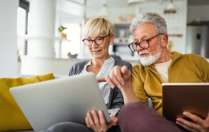Retiree couple reviewing 2025 tax deductions and charitable giving options.